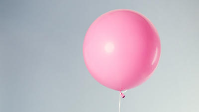Pink balloon with blue background